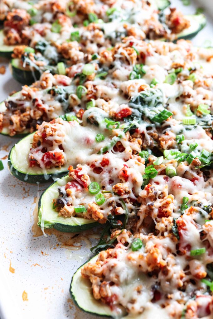 baked zucchini boats stuffed with meat filling and cheese.