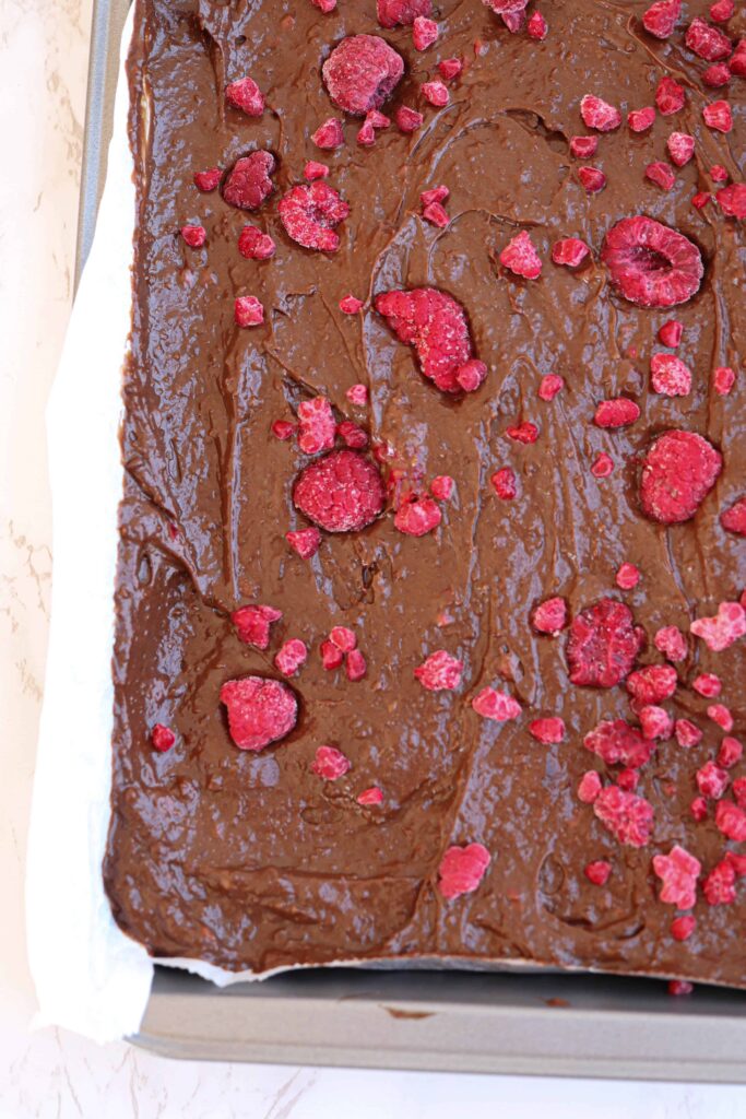unbaked avocado brownies with raspberries.