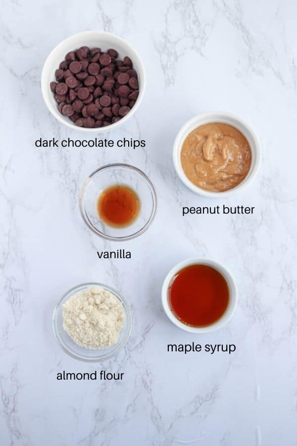 peanut butter eggs ingredients on white marble countertop