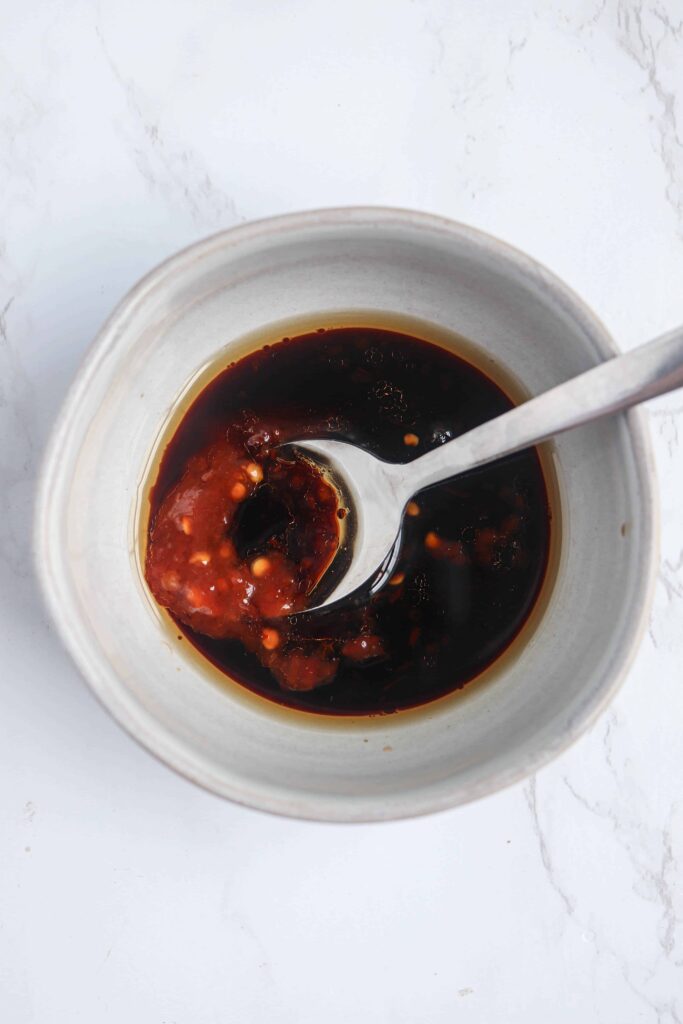 soy chili paste sauce in a small gray bowl.