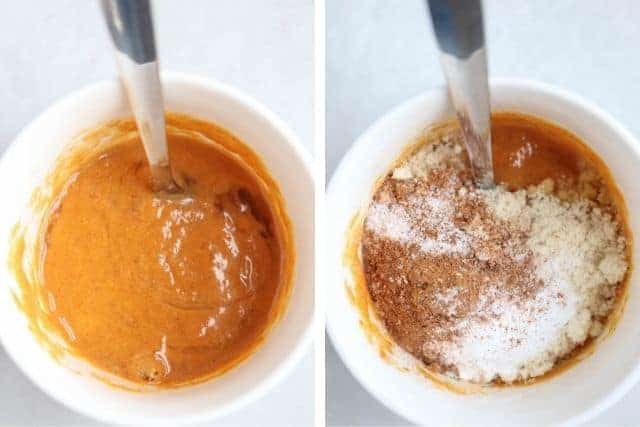 pumpkin mug cake batter in a white mug being stirred with a spoon