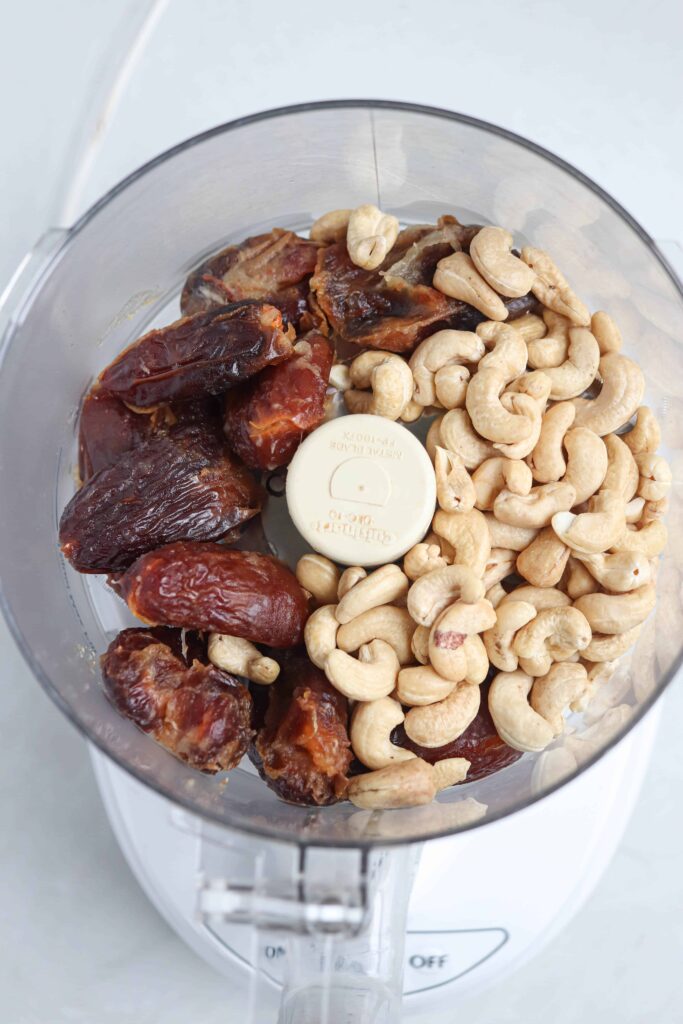 cashews and dates in a food processor.