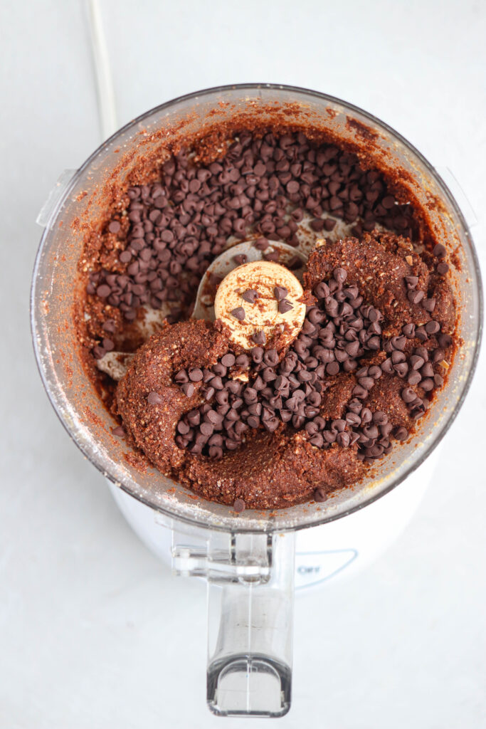 making chocolate bliss balls in a food processor.