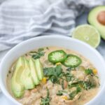 a white bowl of green chicken chili pin with title on top.