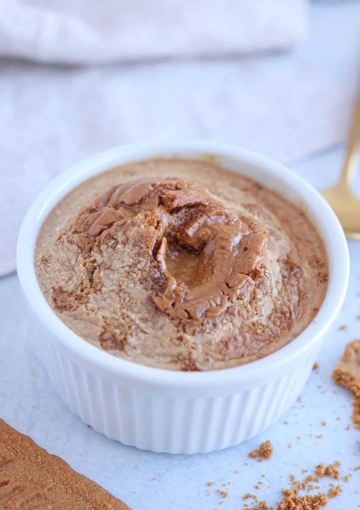 blended Biscoff baked oats in a white ramekin.