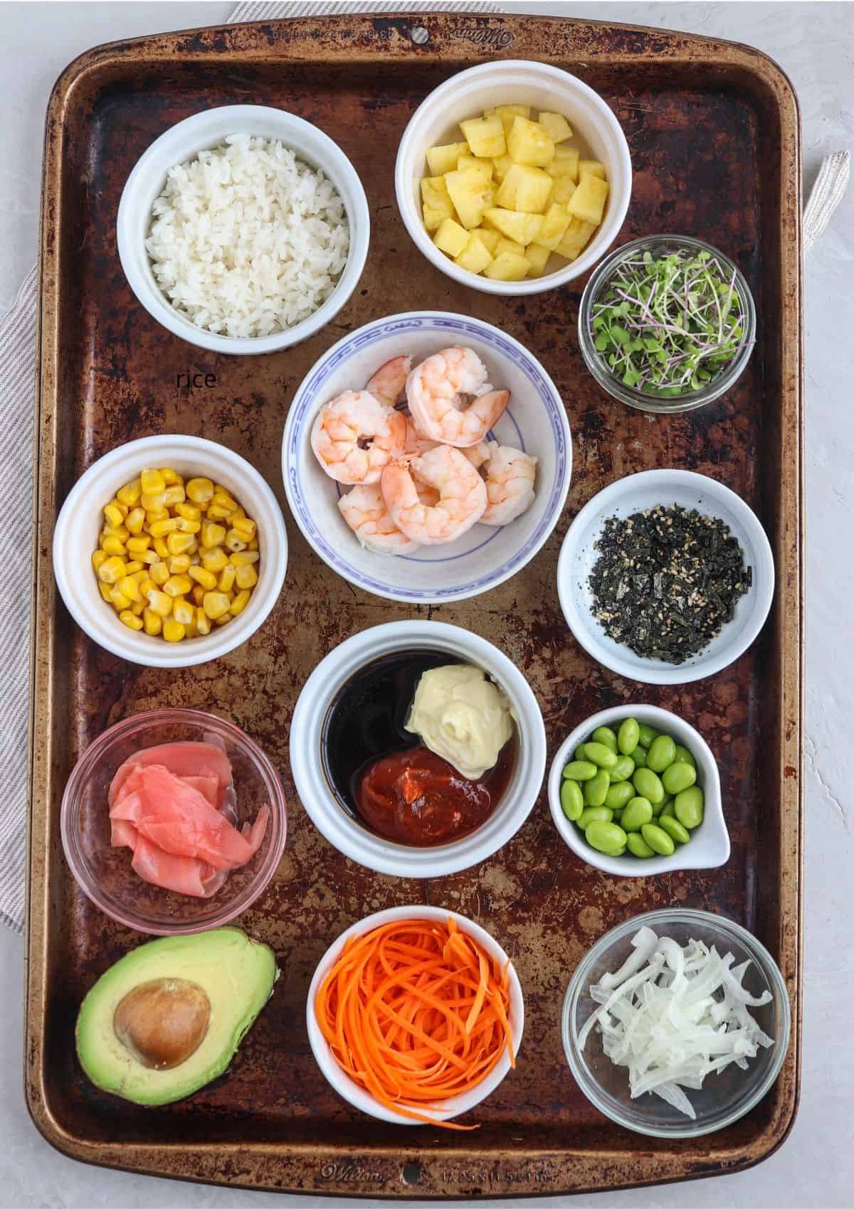 hawaiian shrimp poke bowl in small white round containers on a baking sheet.