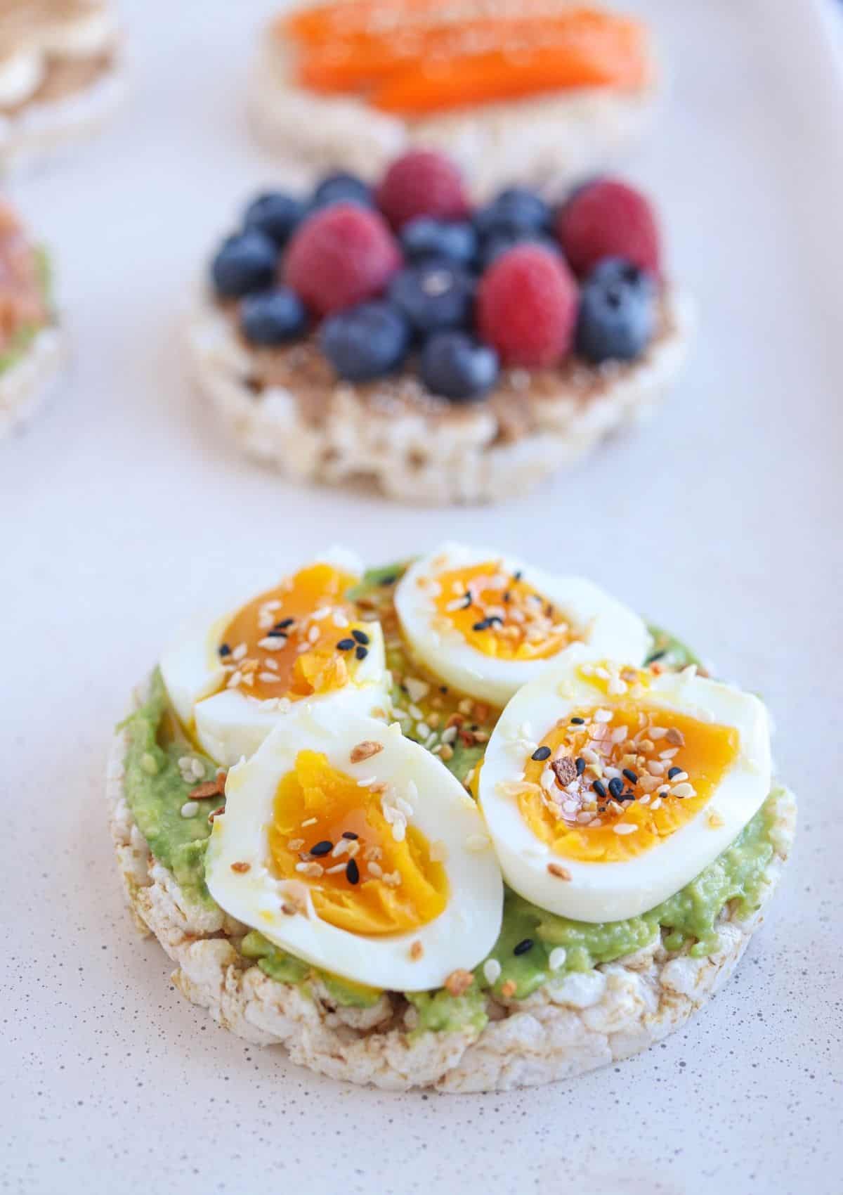 rice cake topped with mashed avocado, soft boiled egg and Everything Bagel seasoning.
