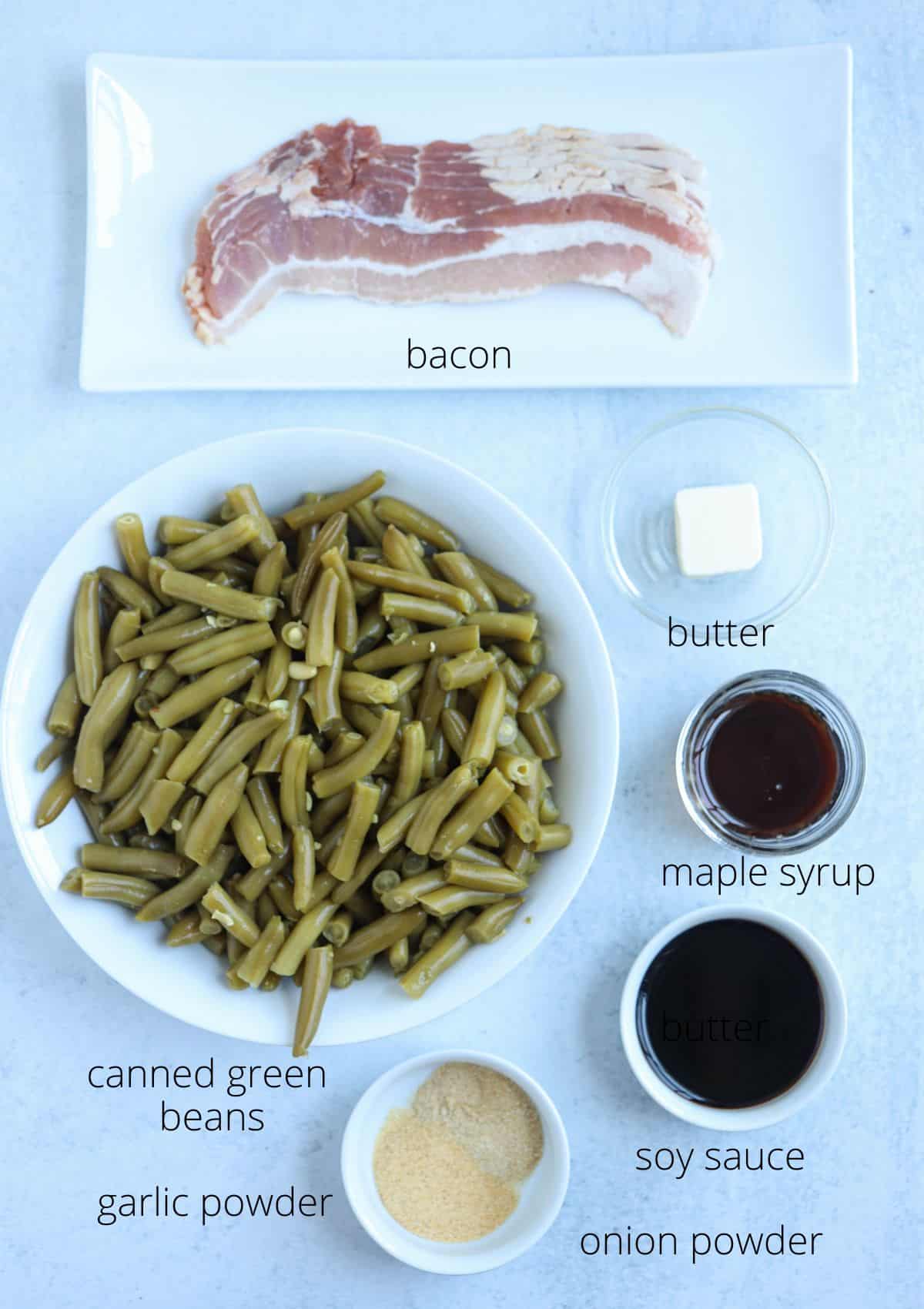 crack green beans ingredients in round containers on light gray surface.
