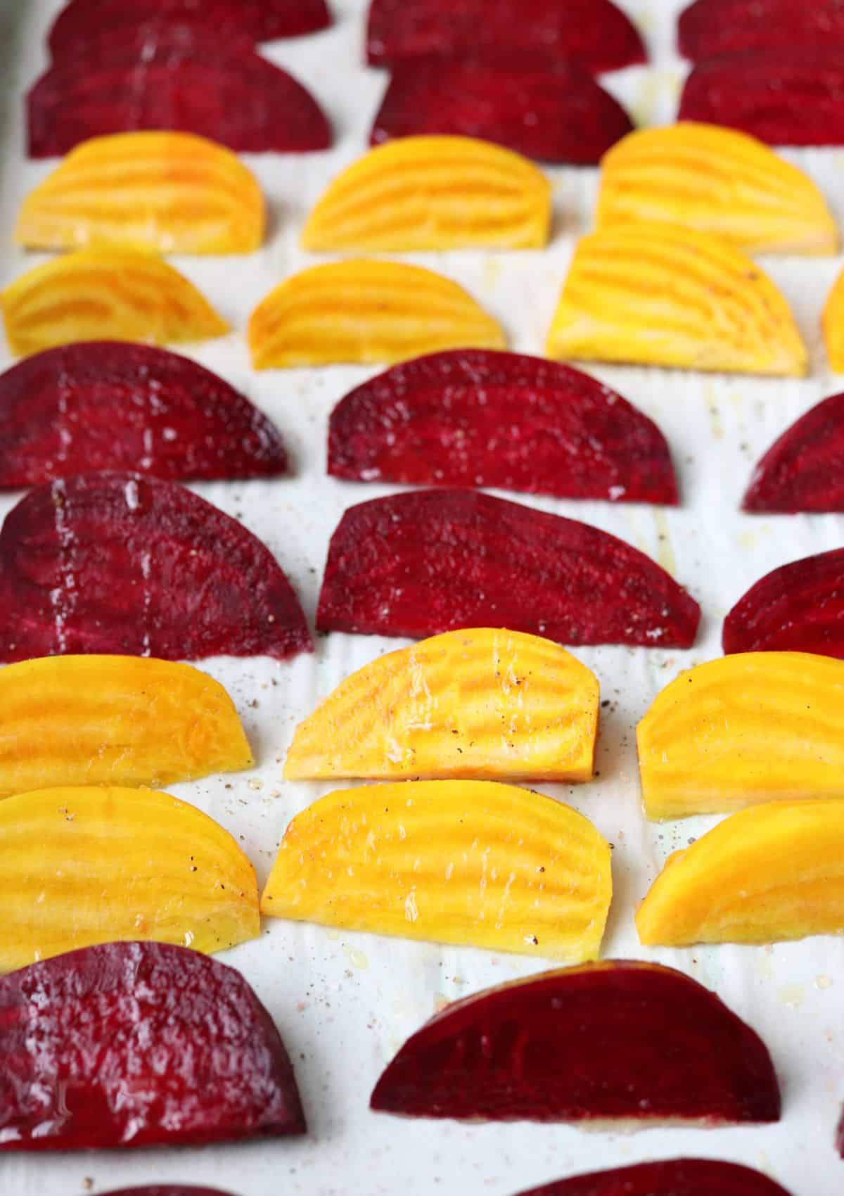 raw beet wedges on paper lined baking sheet. 