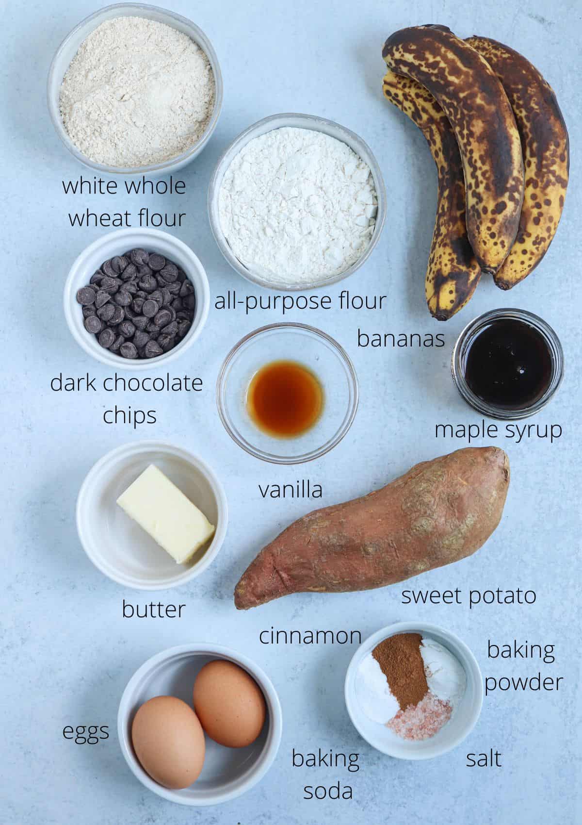 ingredients for making sweet potato banana bread on light gray background with captions.