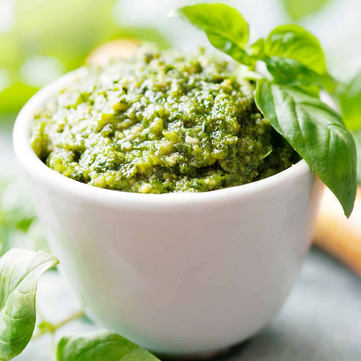basil pesto in a white bowl.
