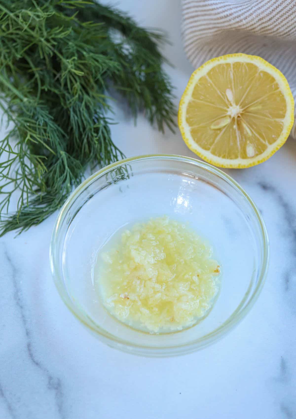 pressed garlic in lemon juice in a small glass bowl. 