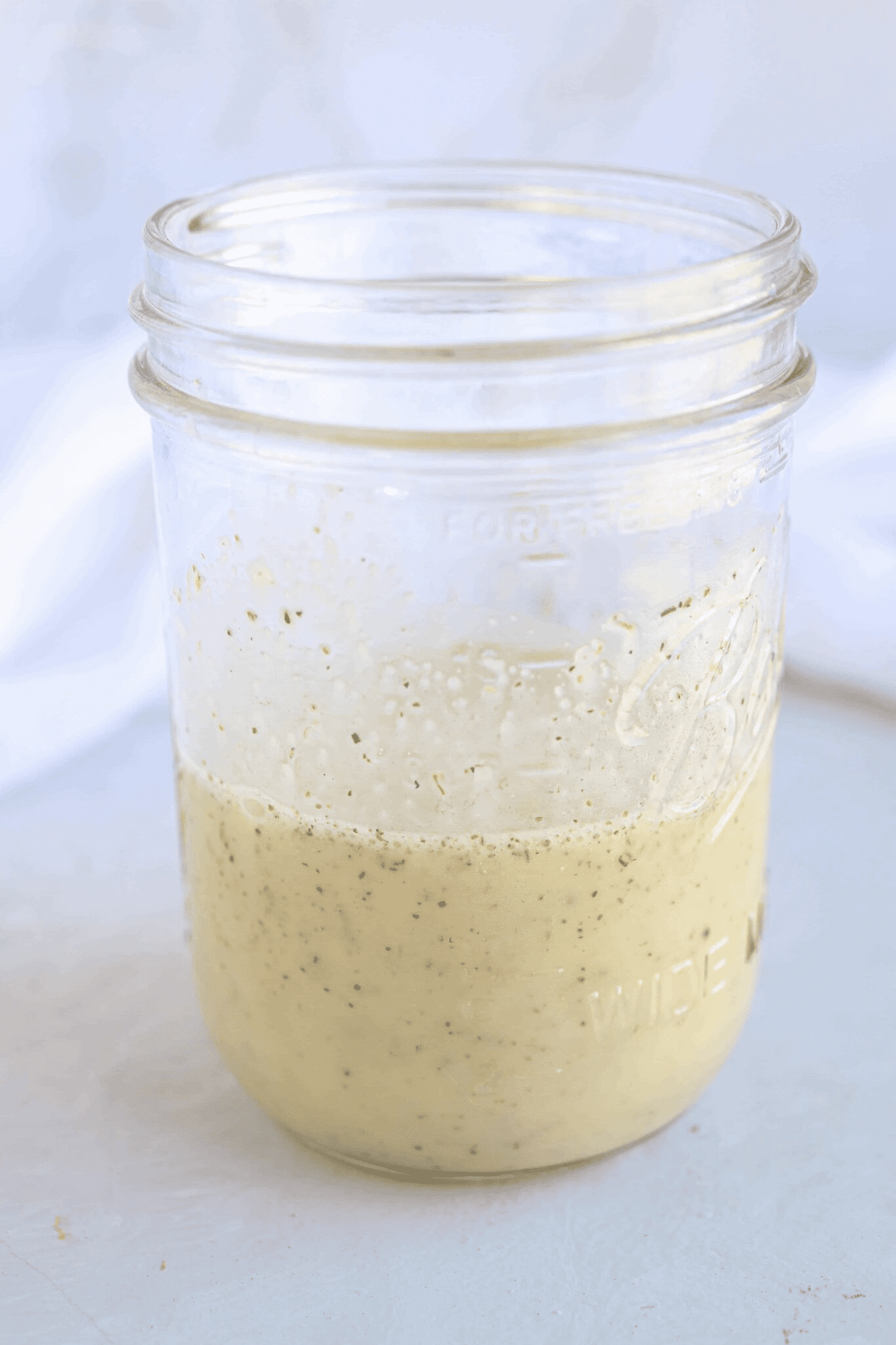 Greek salad dressing in a mason jar.
