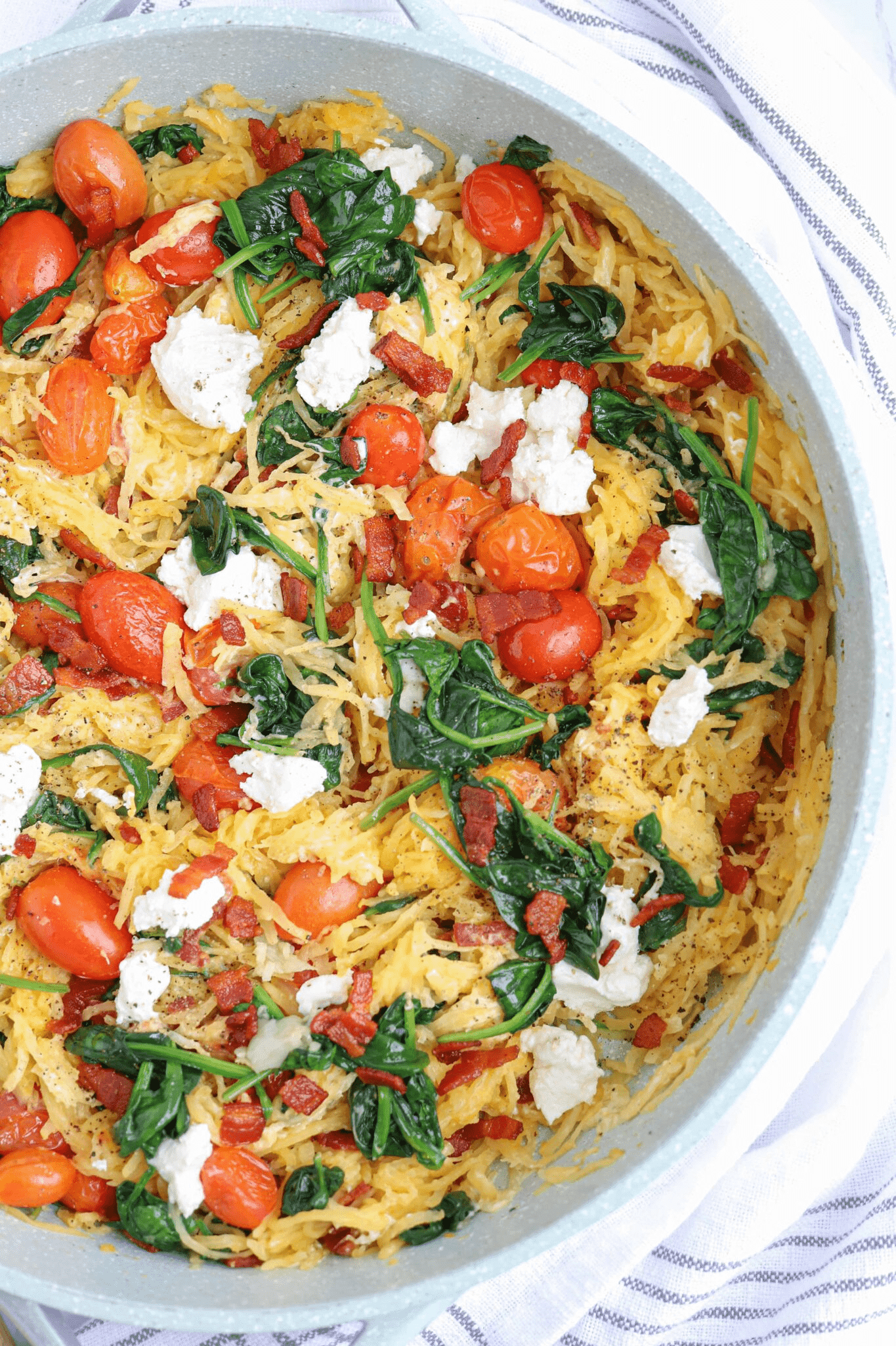 spaghetti squash with spinach, cherry tomatoes, goat cheese and bacon.