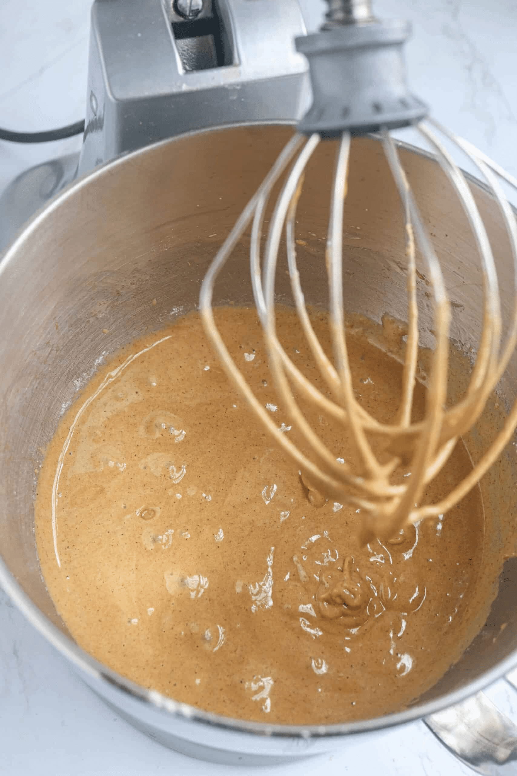 cake batter in a Kitchenaid mixer, overhead view.