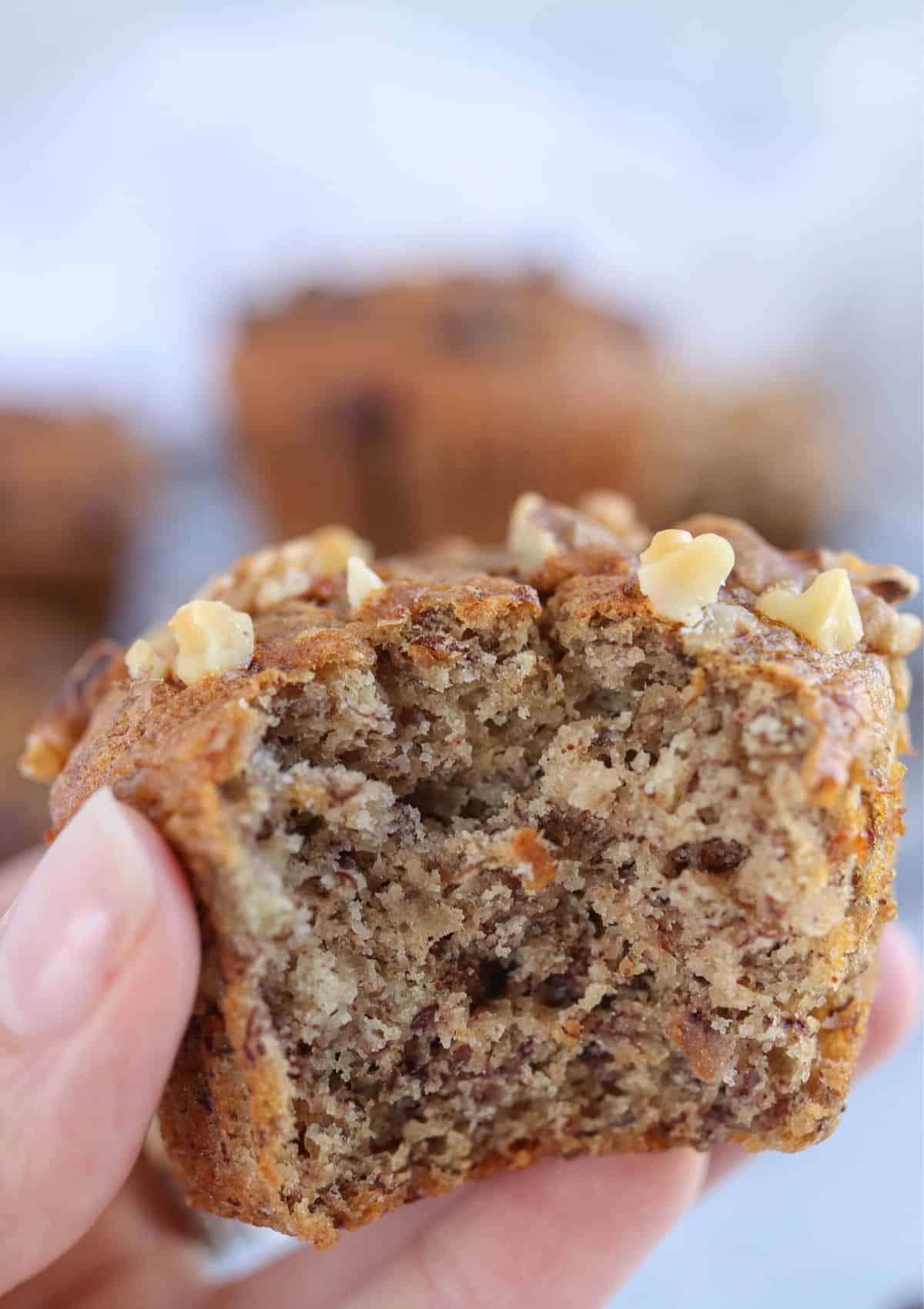 a close up of a banana muffin bitten into.