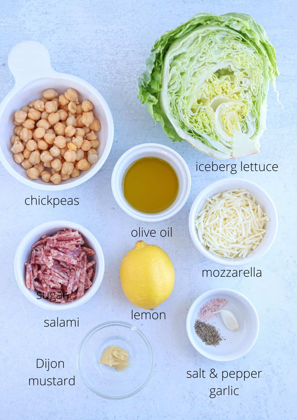 la scala chopped salad ingredients in small containers on a light gray background with captions.