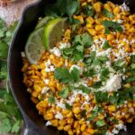 blackened corn in a black cast iron skillet.