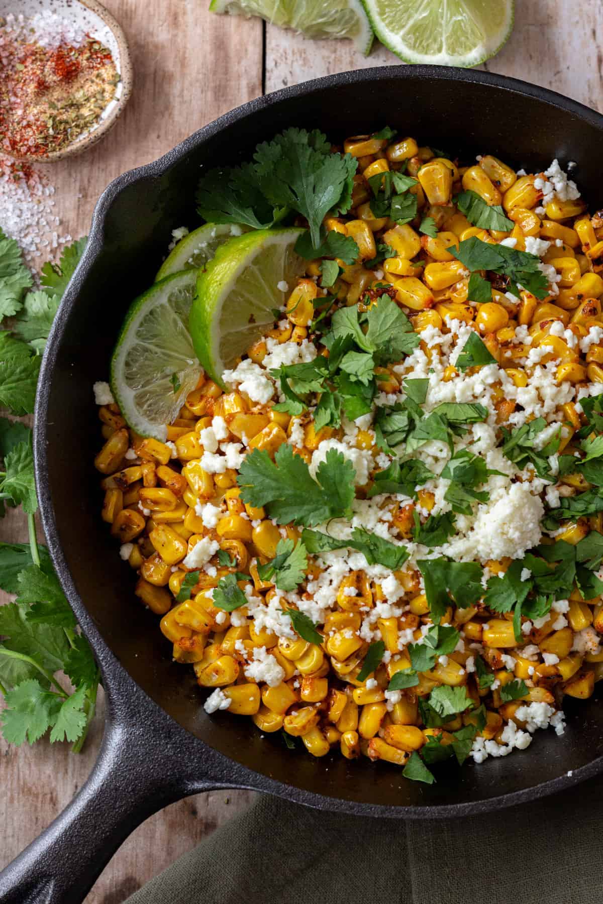 blackened corn in a black cast iron skillet.