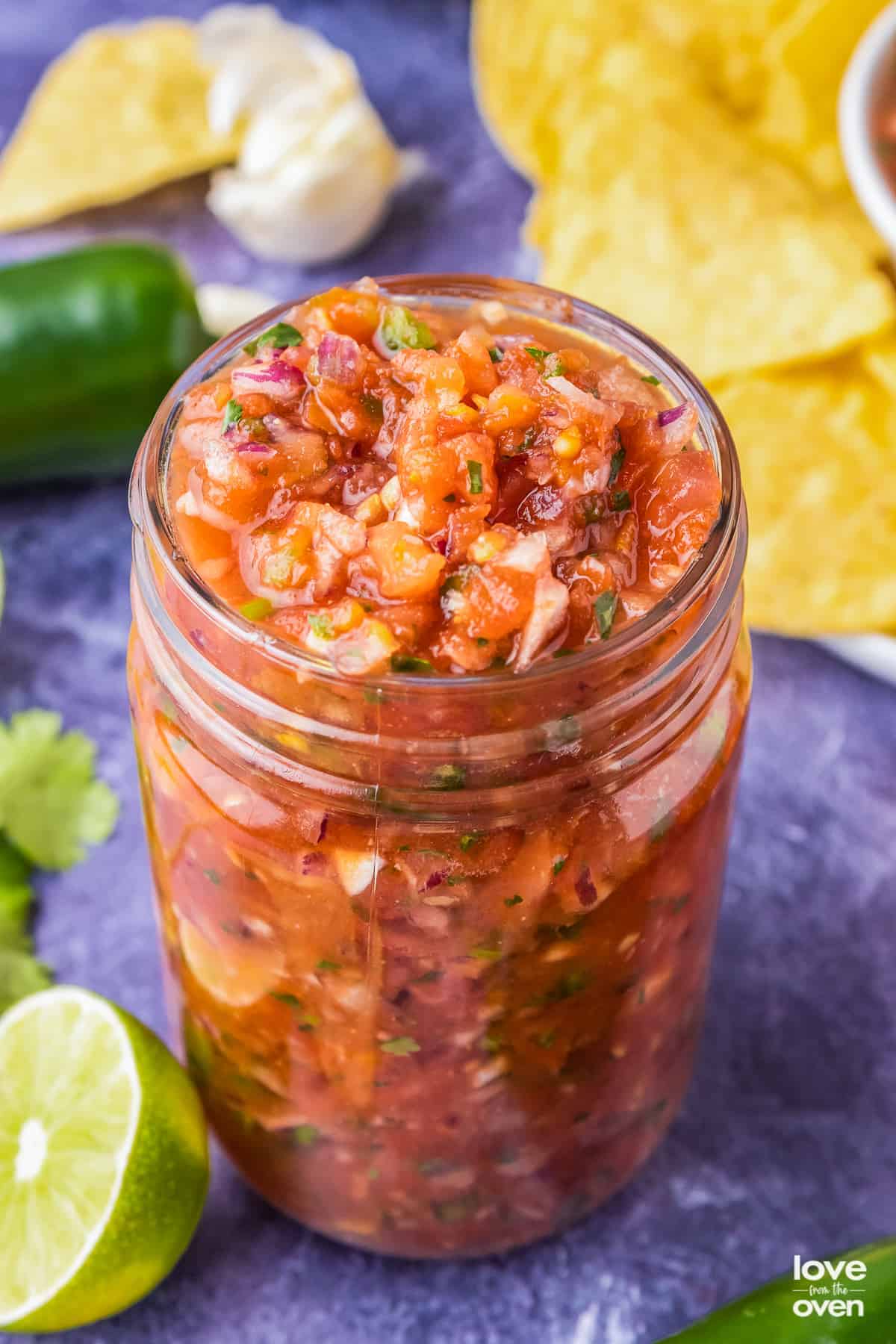 fresh tomato salsa in a mason jar.