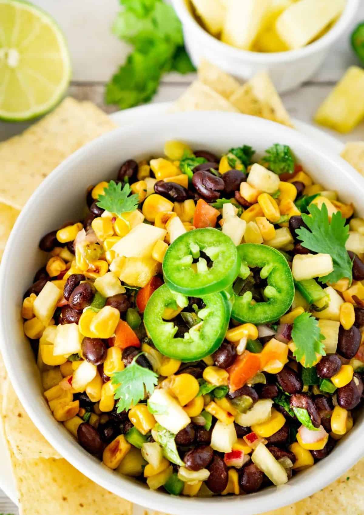 black bean pineapple salsa in a white bowl.