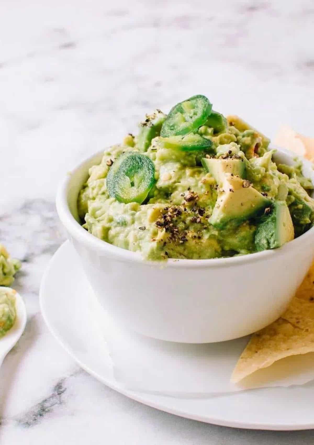 guacamole in a white bowl.