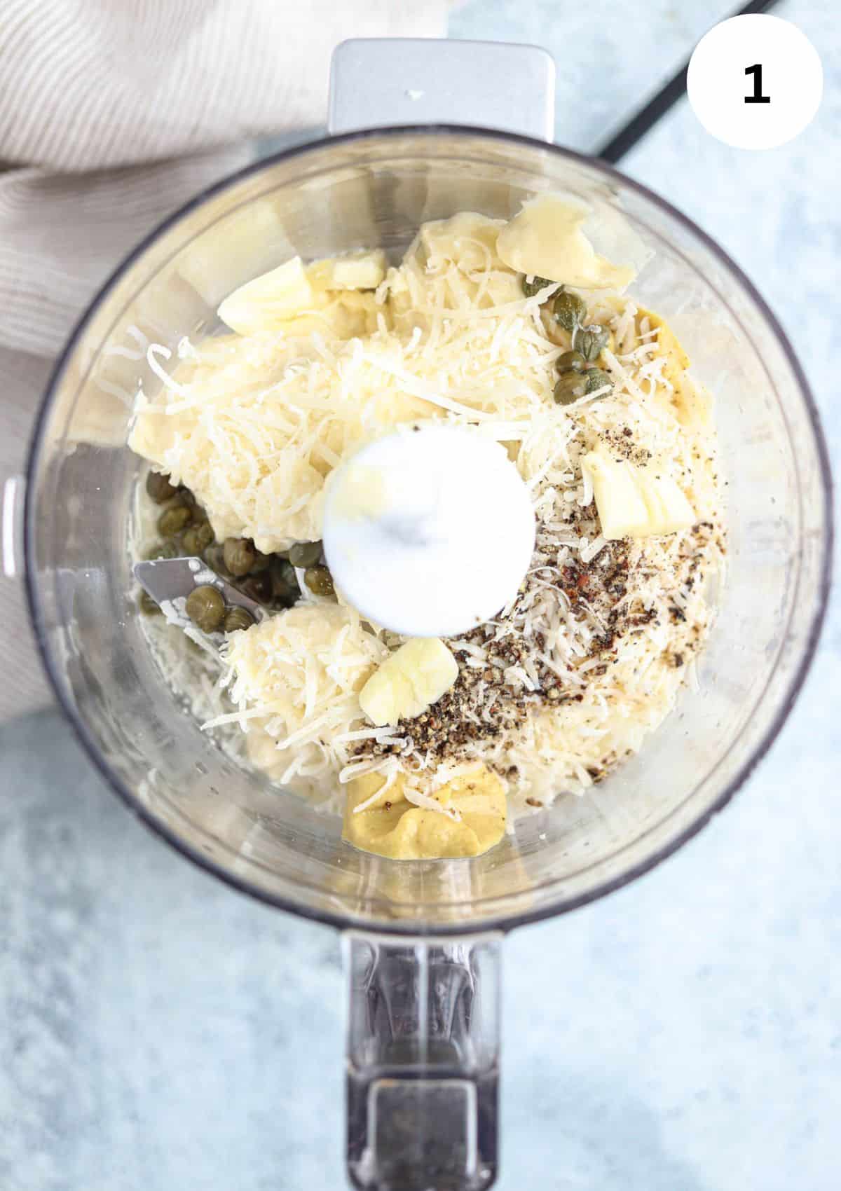making caesar salad dressing in a mini food processor.