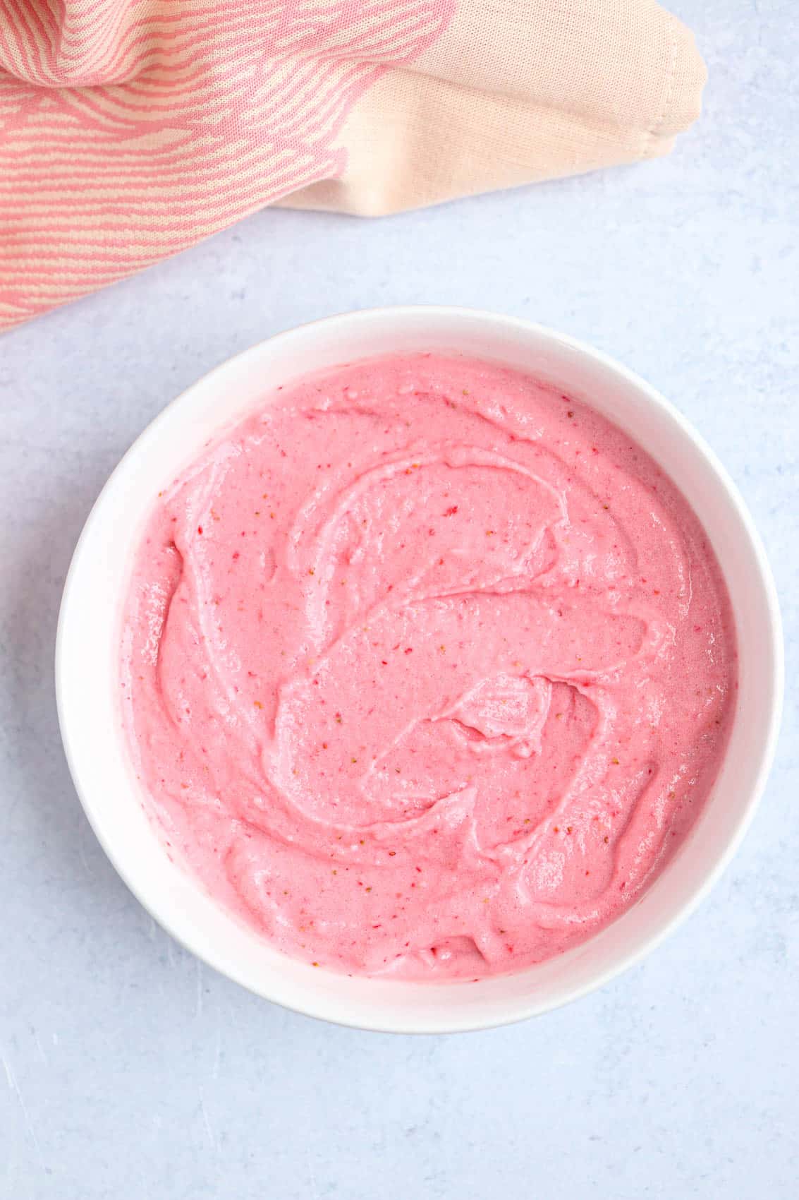 strawberry smoothie bowl in a white bowl.