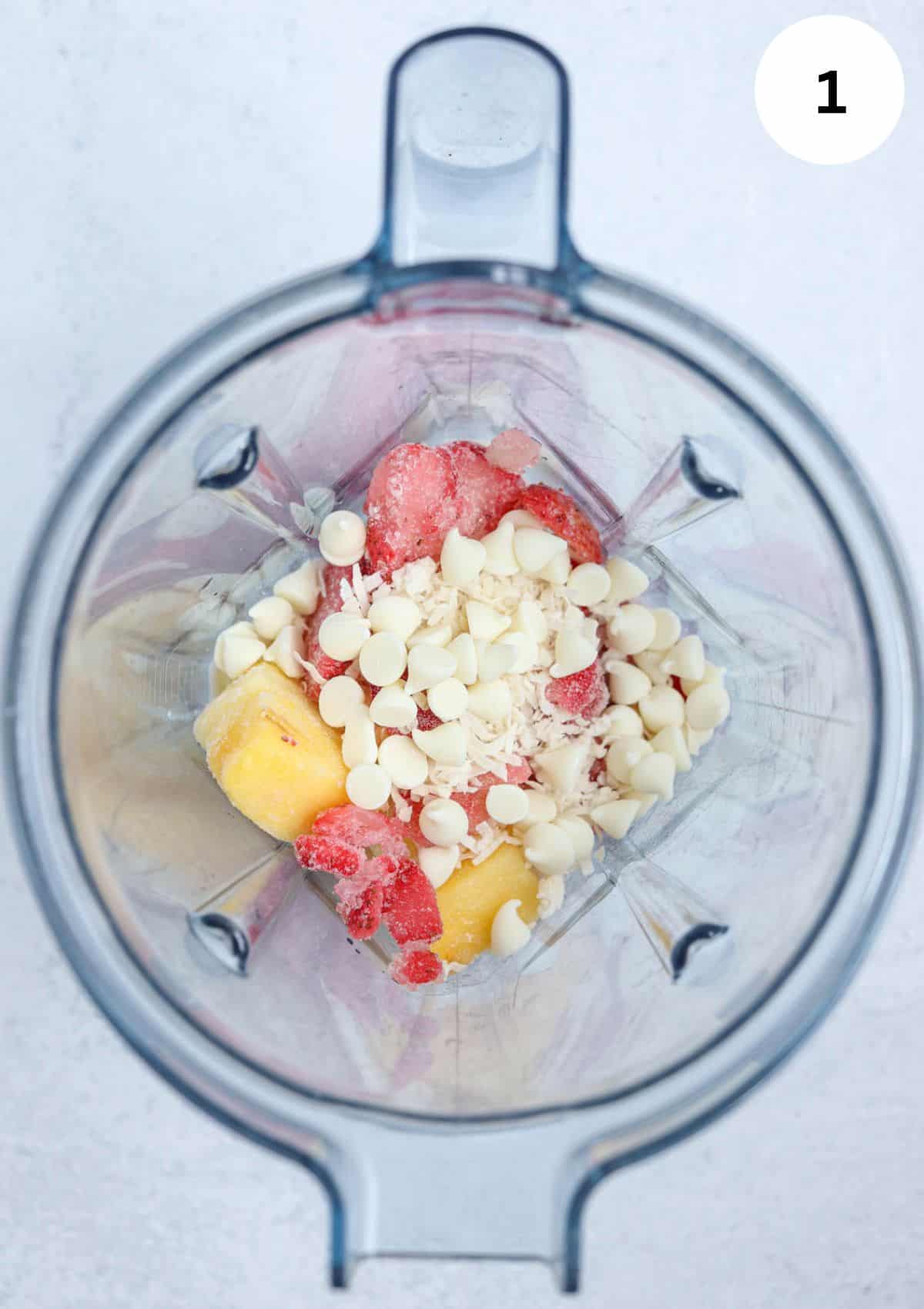 making bahama mama smoothie in a blender before blending.