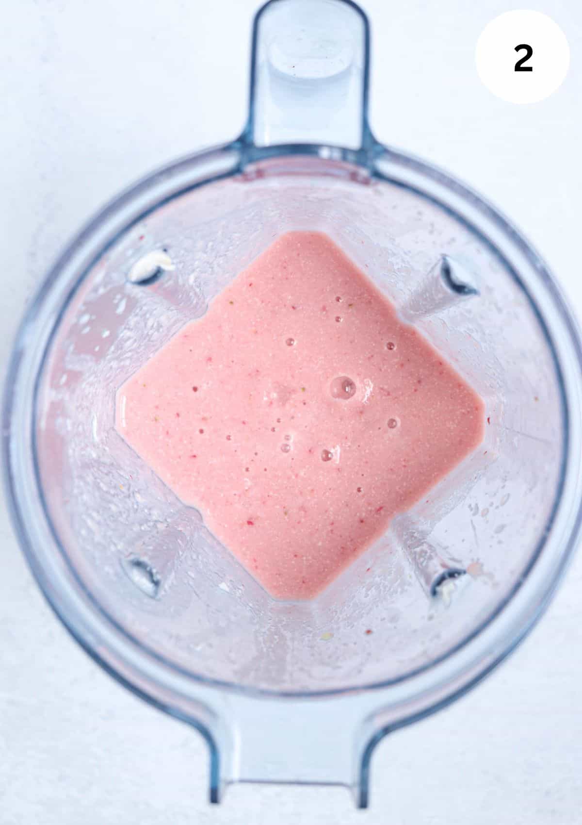 making bahama mama smoothie in a blender after blending.