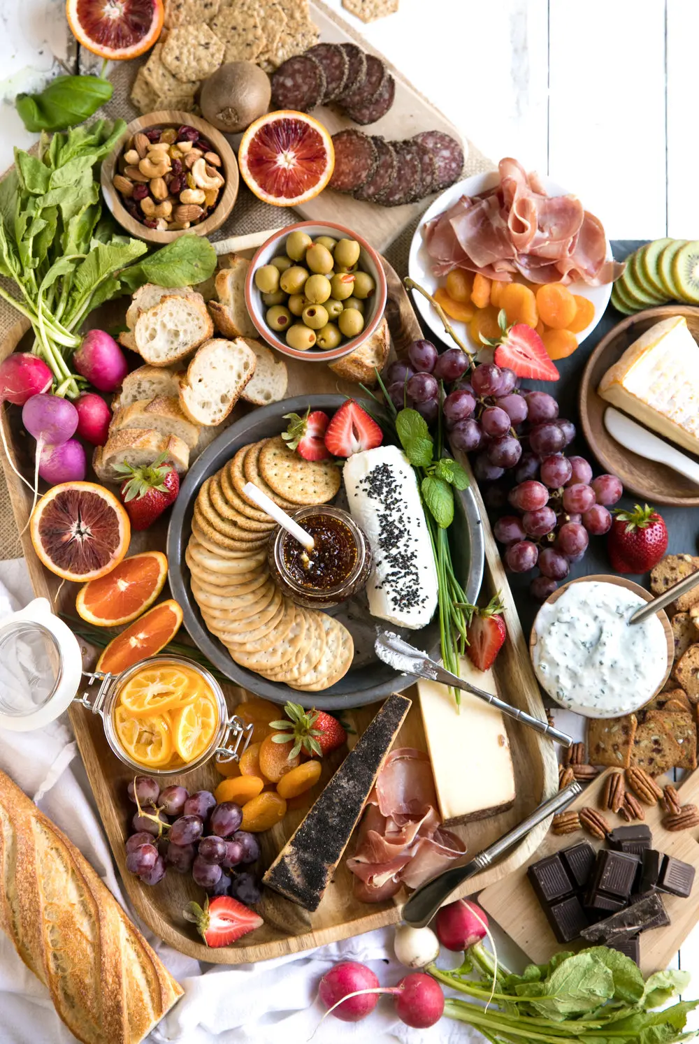 meat and cheese board on white background.