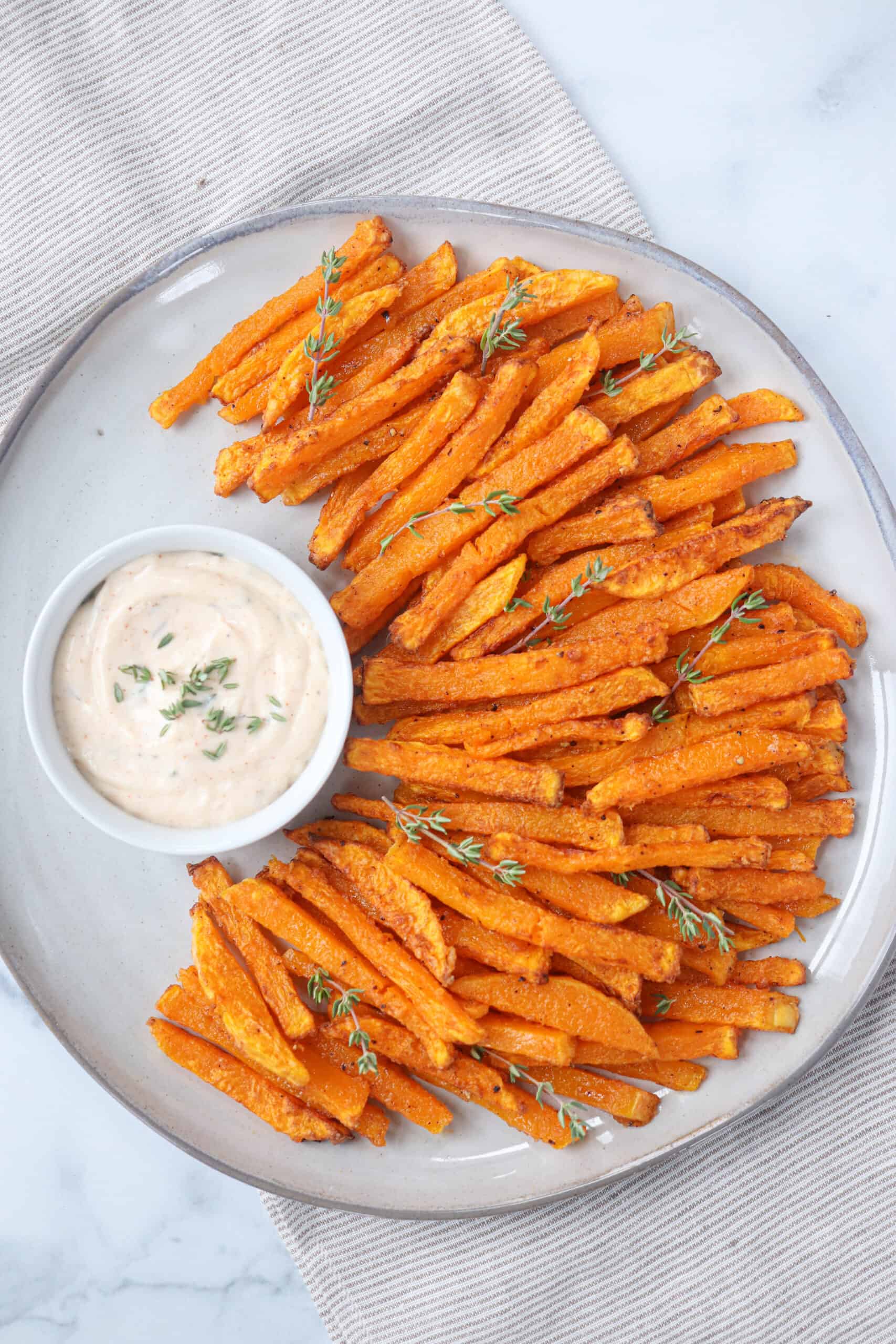 butternut squash fries with a side of dipping sauce. 