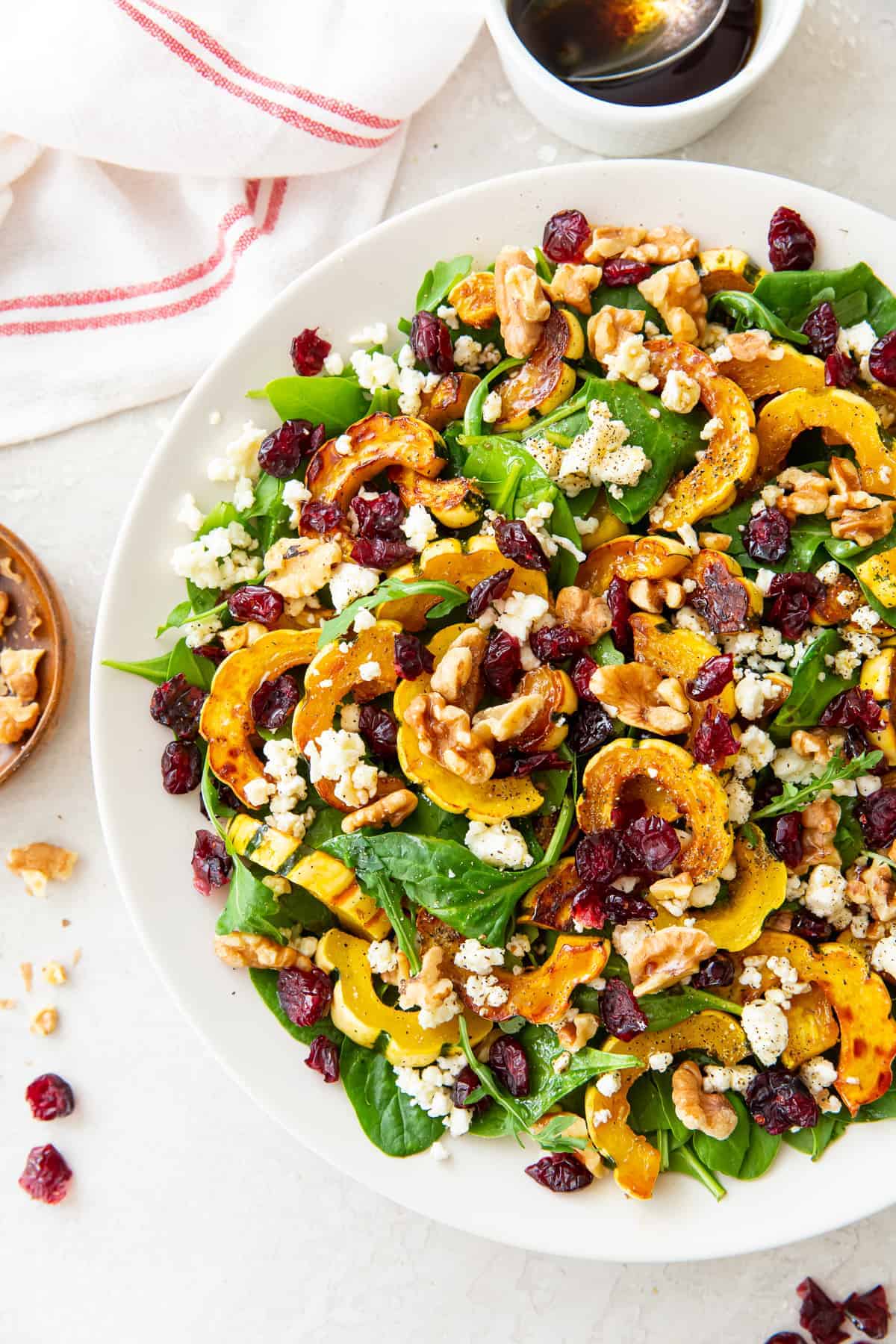 salad with delicata squash, cranberries and nuts. 