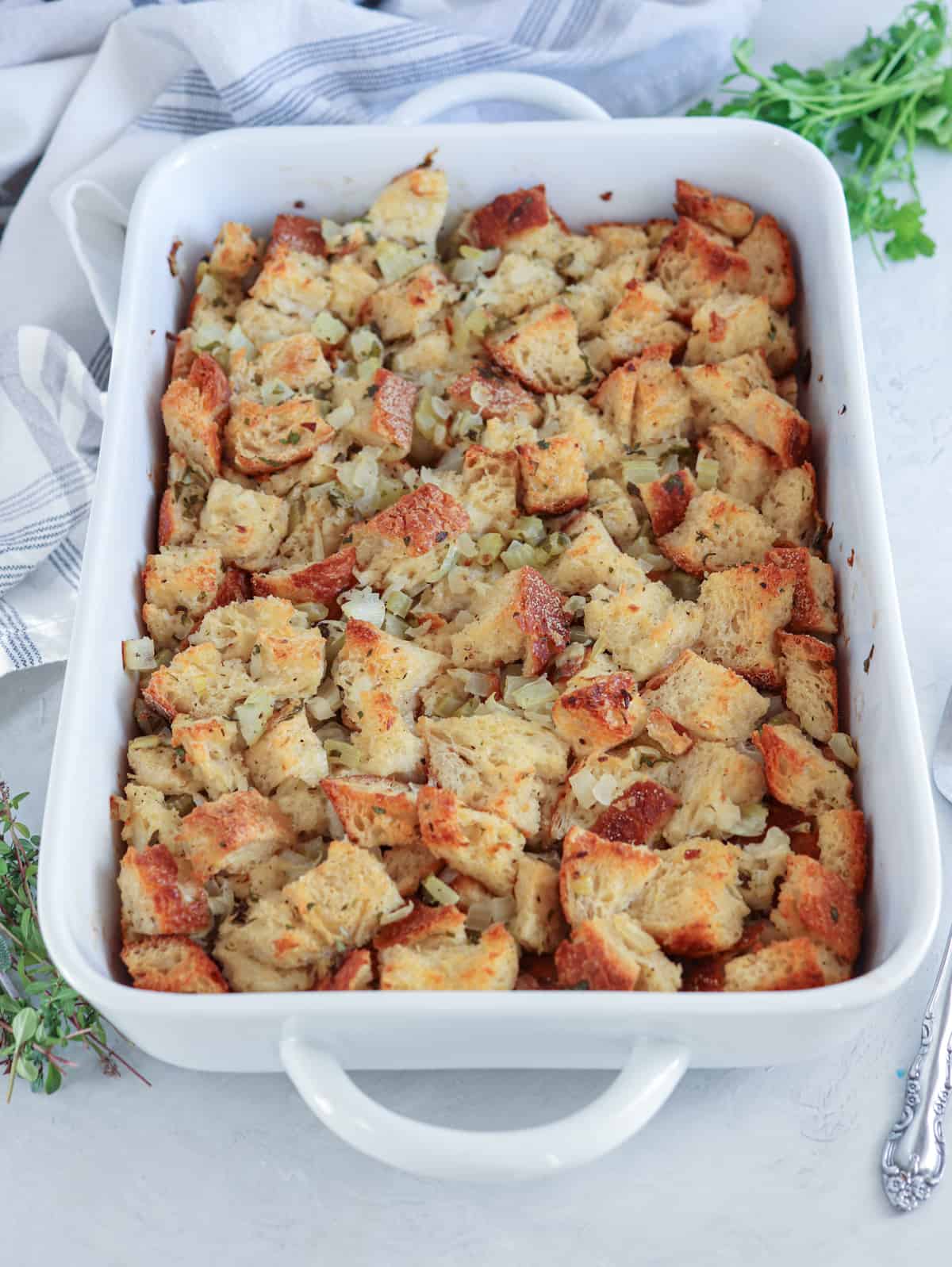 sourdough stuffing in a rectangular casserole dish.
