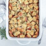 sourdough stuffing in a white baking dish.