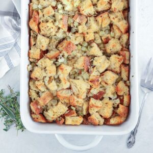 sourdough stuffing in a white baking dish.