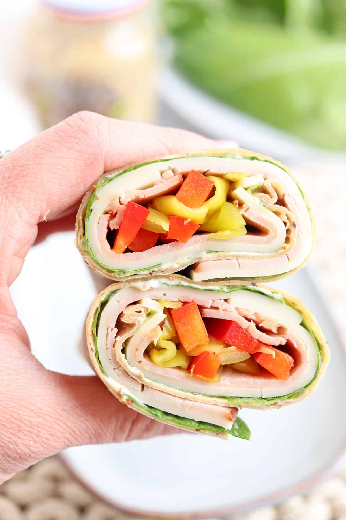 ham and cheese wrap with red peppers and pepperoncini.