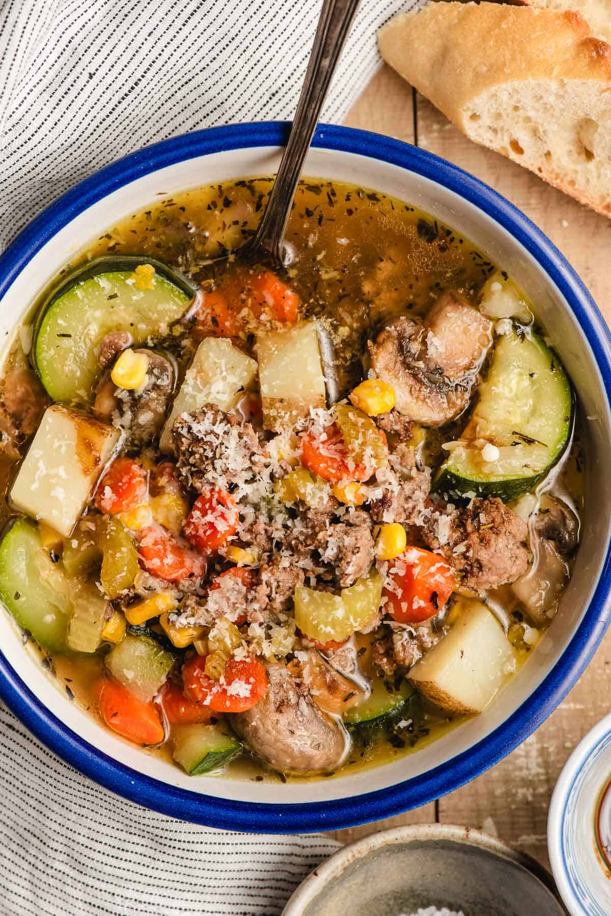 ground beef and vegetable soup sprinkled with parmesan.