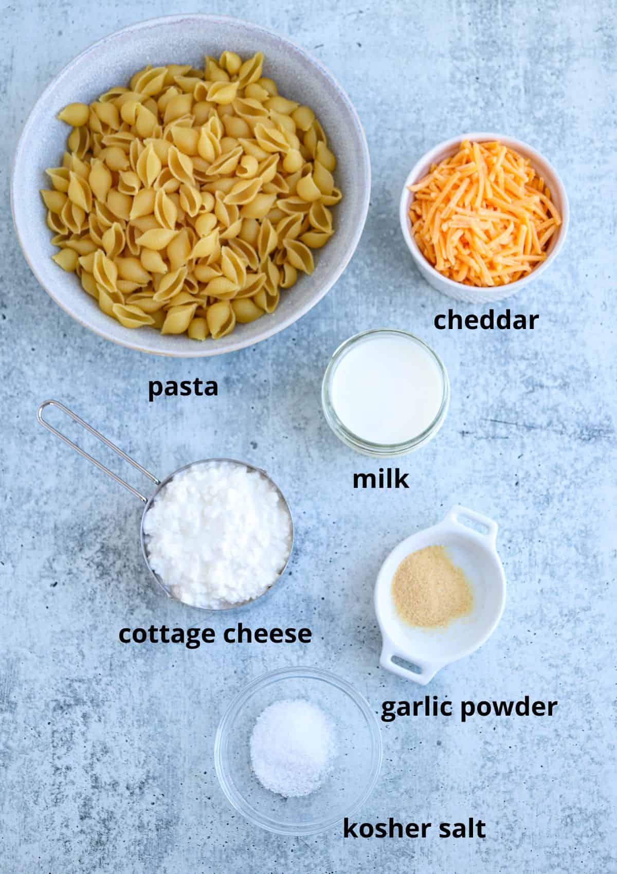 ingredients for making cottage cheese mac and cheese with captions.