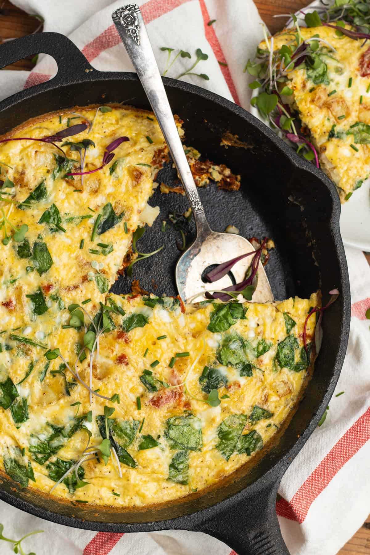 cottage cheese frittata in a cast iron skillet.