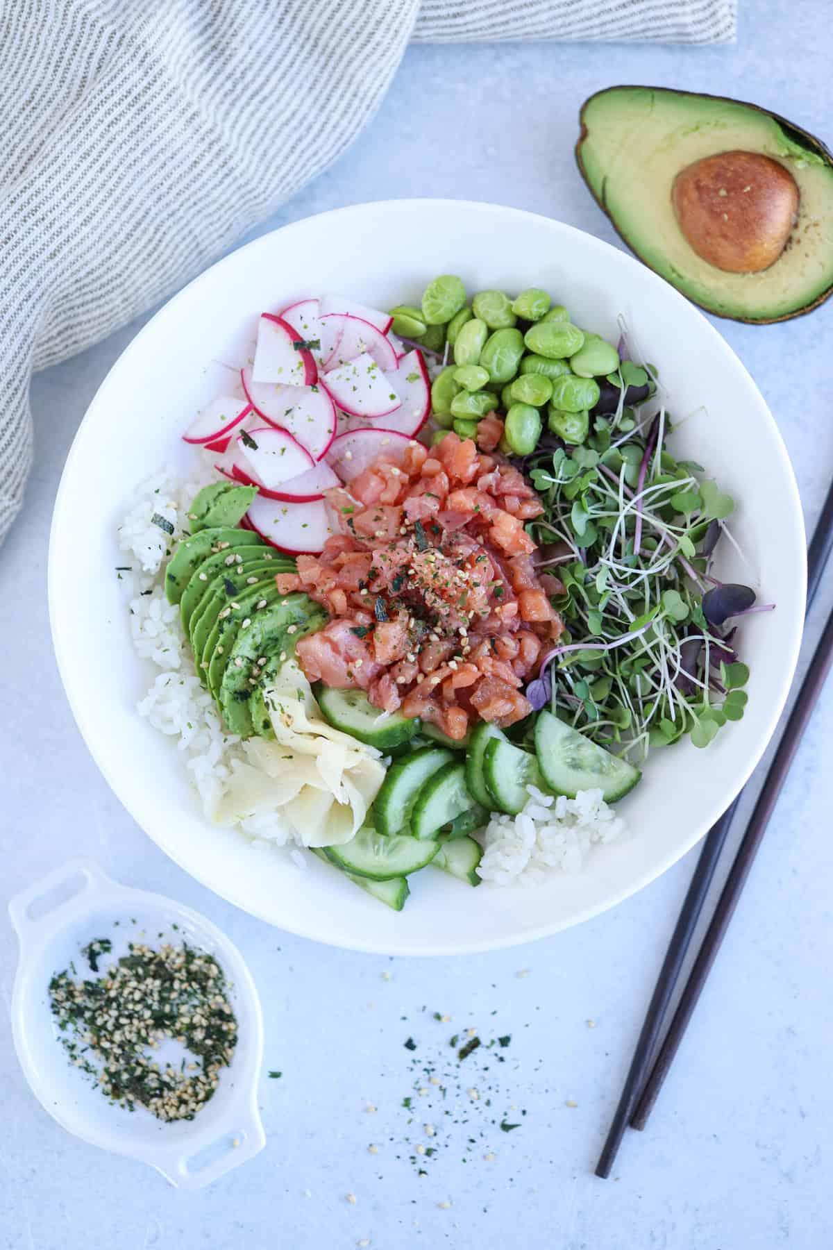 smoked salmon poke bowl with rice and veggies.