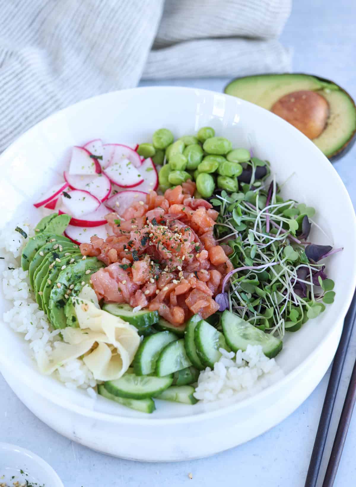 smoked salmon poke bowl with rice and veggies.