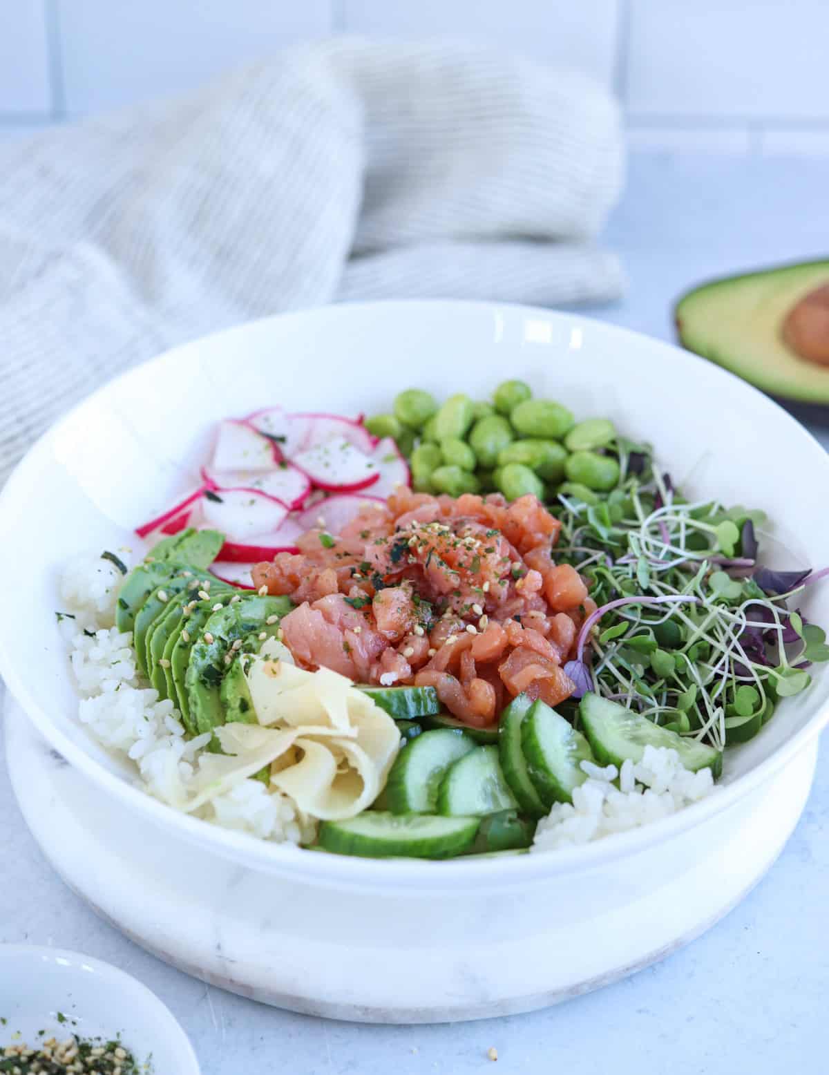 smoked salmon poke bowl with rice and veggies.
