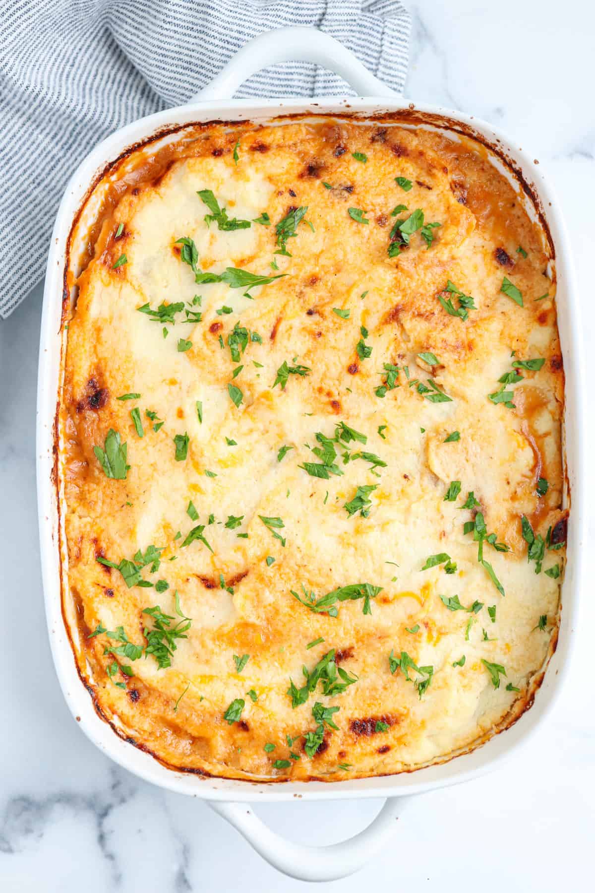 shepherd's pie with ground turkey in a white casserole dish.