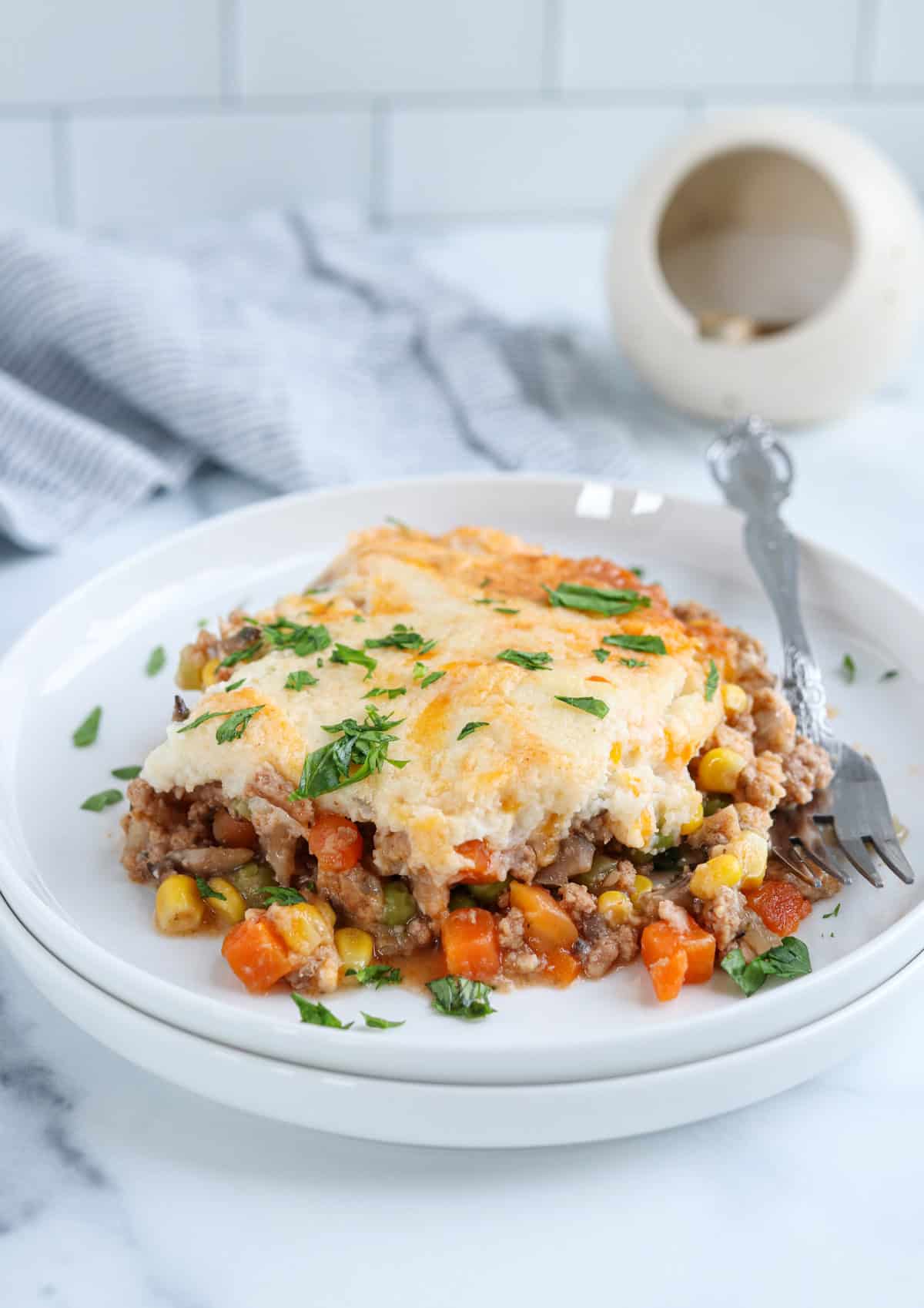 shepherd's pie with ground turkey on a white plate.