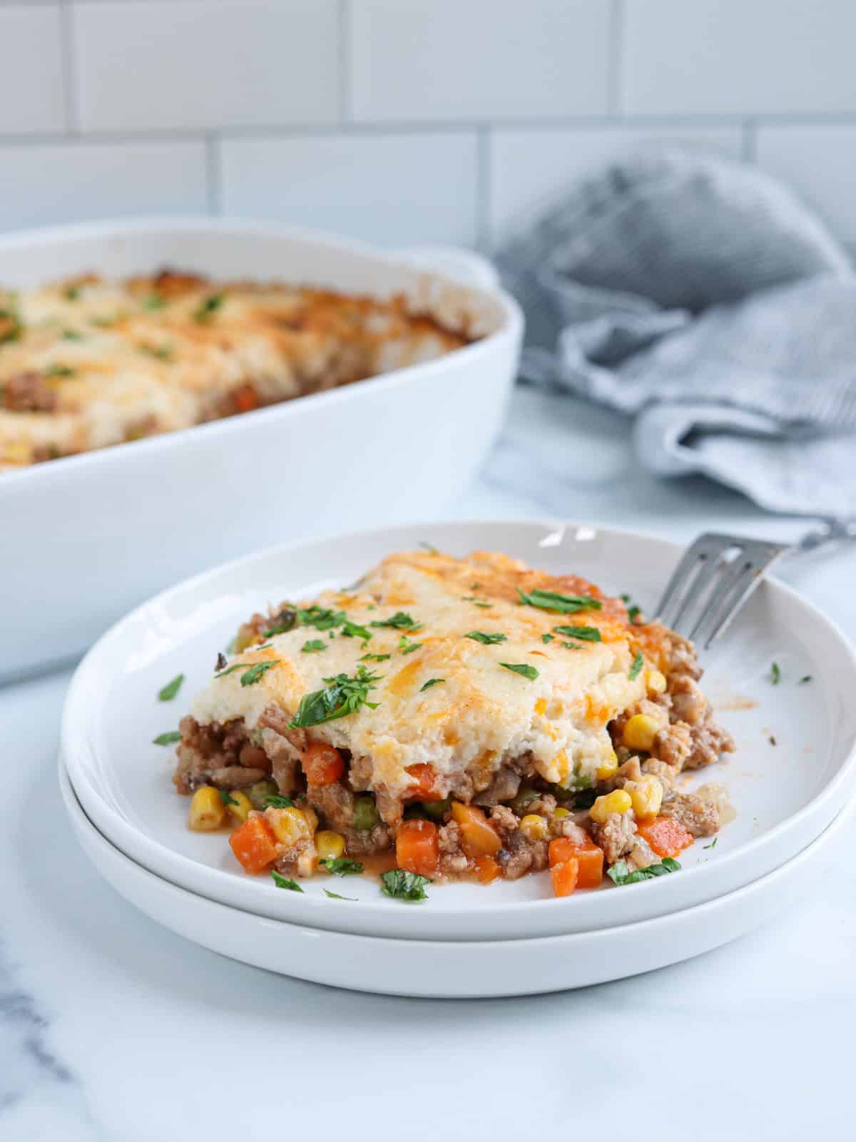 shepherd's pie with ground turkey on a white plate.