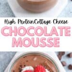 Glass jars filled with chocolate mousse topped with whipped cream, chocolate shavings, and raspberries. Text overlay reads High Protein Cottage Cheese Chocolate Mousse. Background includes chocolate chips and blurred bowls.